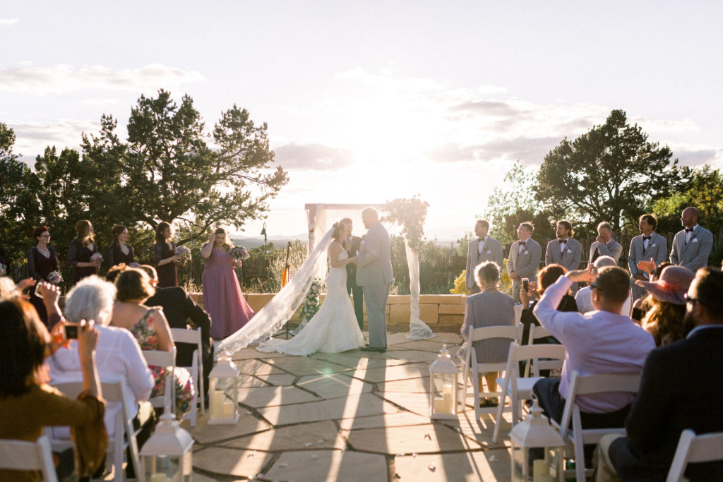 Gorgeous shot of a local couple sharing their vows during their wedding ceremony at the Four Seasons in Santa Fe, New Mexico.