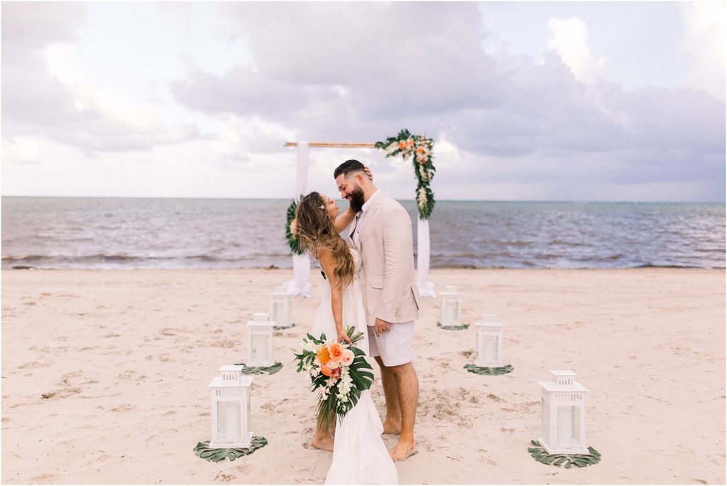 A happy moment between the two, Lais DeLeon and Dr. Beau Hightower, after having their wedding and beach elopement ceremony in the sand. By Shayla Cristine Photography, the best local wedding photographers based in Albuquerque, New Mexico. 