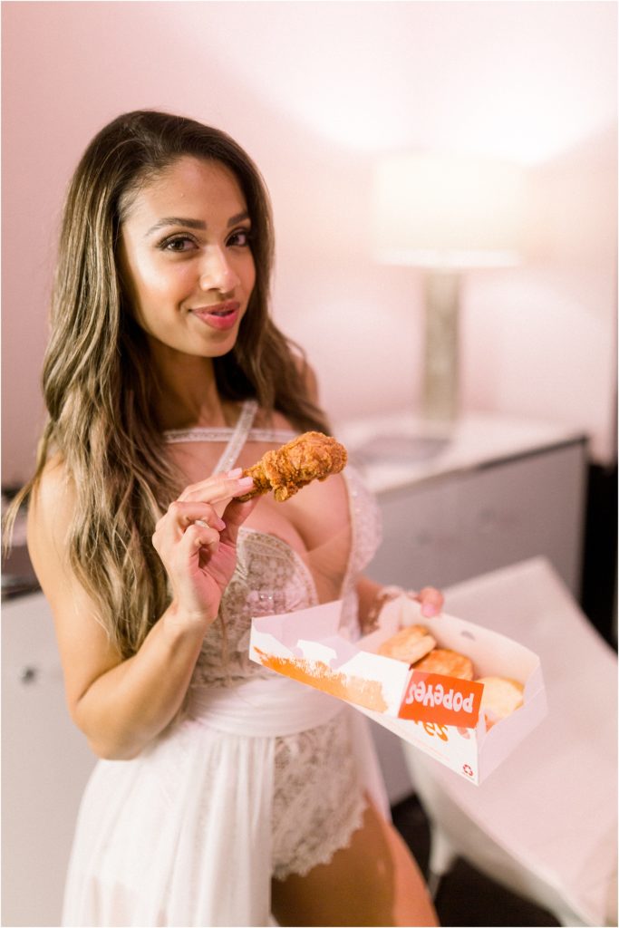 Lais DeLeon enjoys some Popeye's chicken after her beach wedding ceremony with Beau Hightower. Shot by New Mexico's best adventure wedding photographer, Shayla Cristine Photography!
